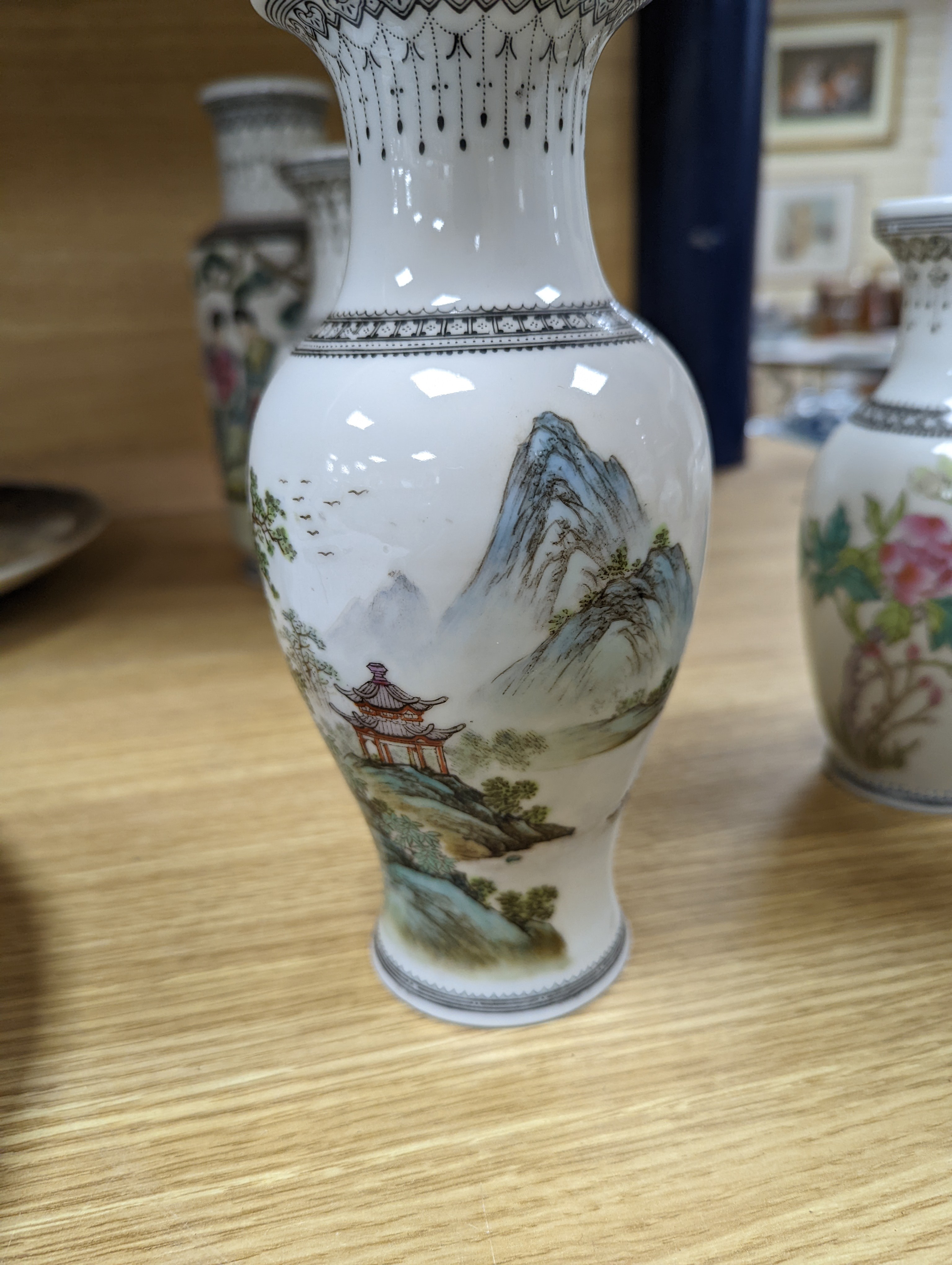 A group of seven Chinese famille rose vases, 20th century